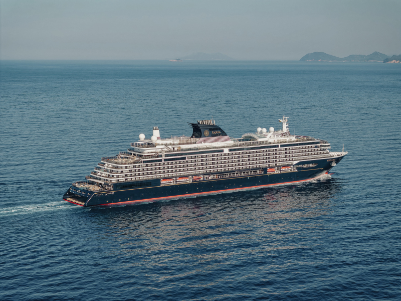 Ocean cruise ship sailing through beautiful blue waters